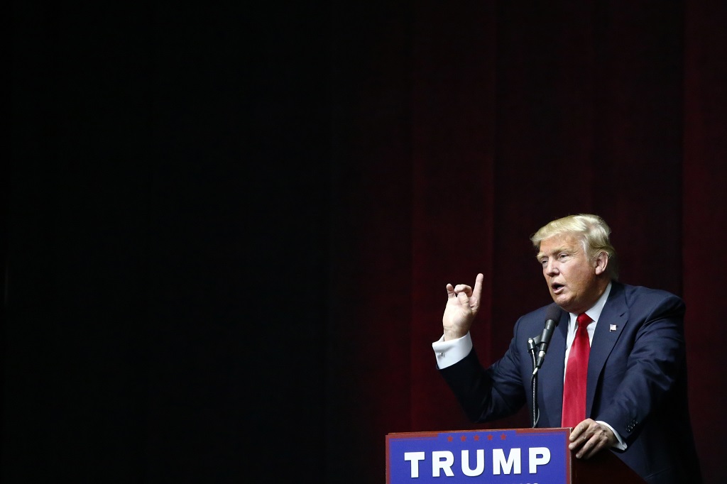 US Republican presidential candidate Donald Trump addresses a rally in Bethpage, Long Island, New York on April 6, 2016. Trump looks to bounce back from his unsettling presidential primary los in Wisconsin, training his sights in the next White House contests on friendlier ground -- his home state of New York. / AFP PHOTO / KENA BETANCUR