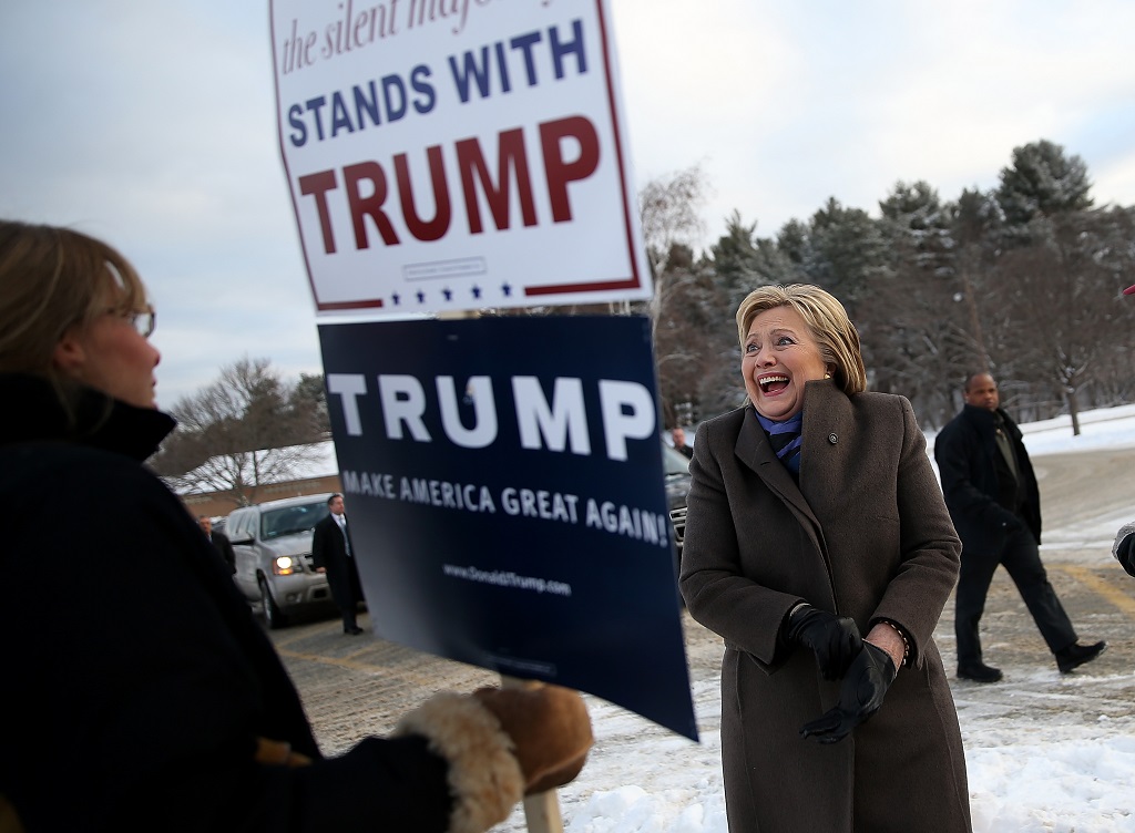 Democratic presidential candidate former Secretary of State Hillary Clinton greets voters outside of a polling station at Fairgrounds Junior High School on February 9, 2016 in Nashua, New Hampshire. New Hampshire voters are heading to the polls in the nation's first primaries.