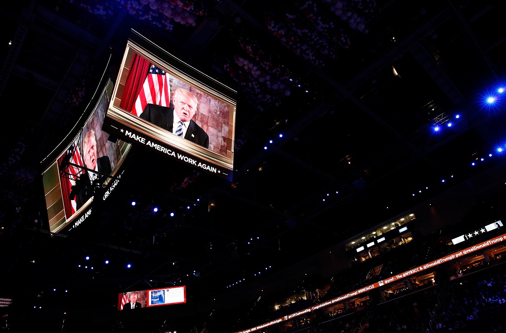 CLEVELAND, OH - JULY 19: Republican presidential candidate Donald Trump is seen speaking on a screen from New York City, on the second day of the Republican National Convention on July 19, 2016 at the Quicken Loans Arena in Cleveland, Ohio. Republican presidential candidate Donald Trump received the number of votes needed to secure the party's nomination. An estimated 50,000 people are expected in Cleveland, including hundreds of protesters and members of the media. The four-day Republican National Convention kicked off on July 18. (Photo by Win McNamee/Getty Images)