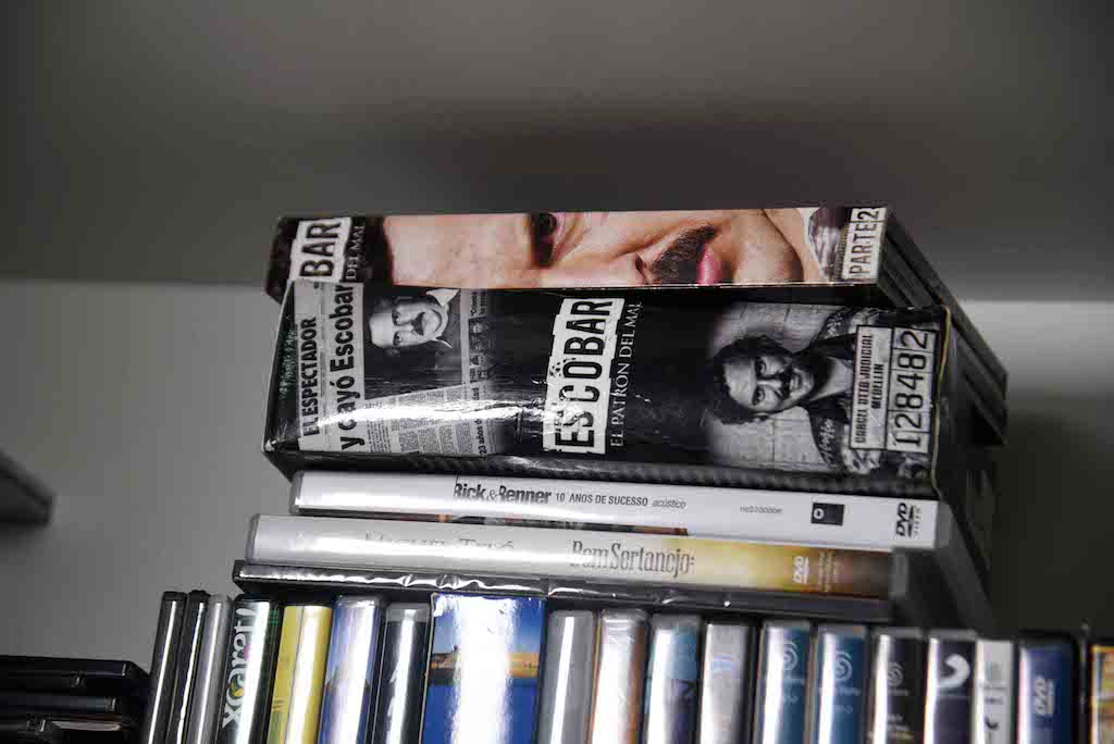 View of books and DVDs at Brazilian drug trafficker Jarvis Chimenes Pavao's cell at Tacumbu prison in Asuncion on July 28, 2016. Three rooms, a plasma TV, a library, and even a collection of DVDs of Colombian Pablo Escobar TV series, Jarvis Pavao Chimenes lived in a luxury cell in Tacumbu prison, one of the most crowded of Paraguay. / AFP PHOTO / NORBERTO DUARTE / TO GO WITH AFP STORY