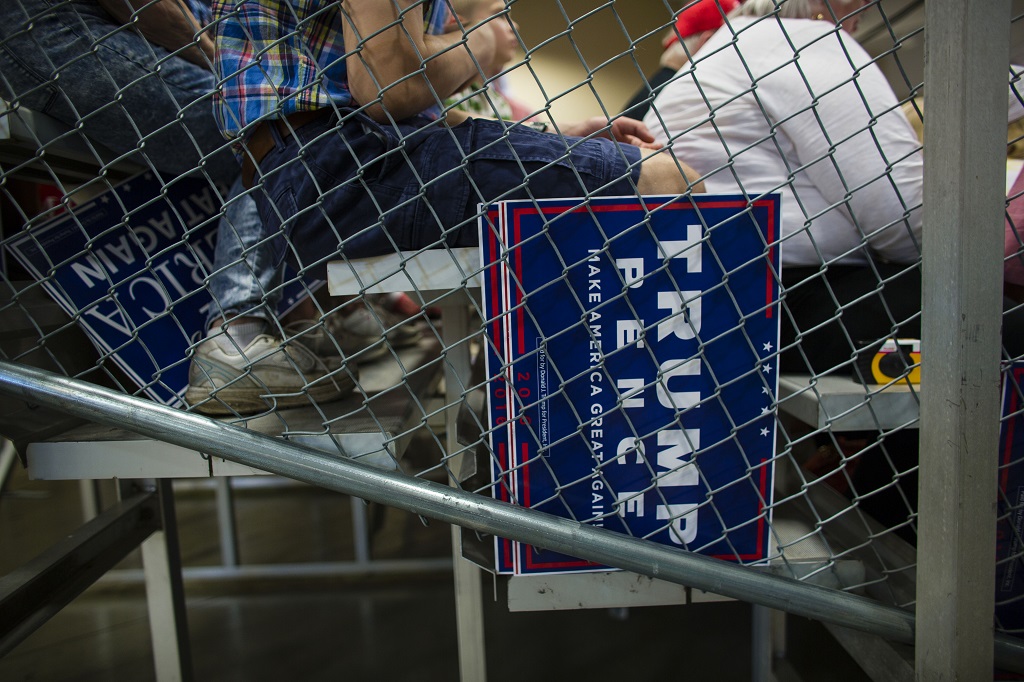 WEST BEND, WI - AUGUST 16: A Trump supporters wait to hear Republican presidential nominee Donald Trump speak at a rally on August 16, 2016 in West Bend, Wisconsin.   Darren Hauck/Getty Images/AFP / AFP PHOTO / GETTY IMAGES NORTH AMERICA / Darren Hauck