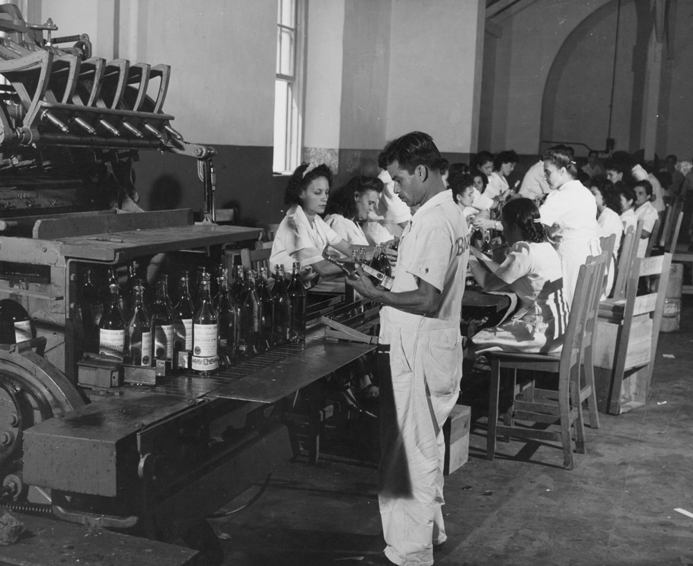 circa 1955: Workers at the Bacardi rum bottling plant. (Photo by Victor Kayfetz/Three Lions/Getty Images)