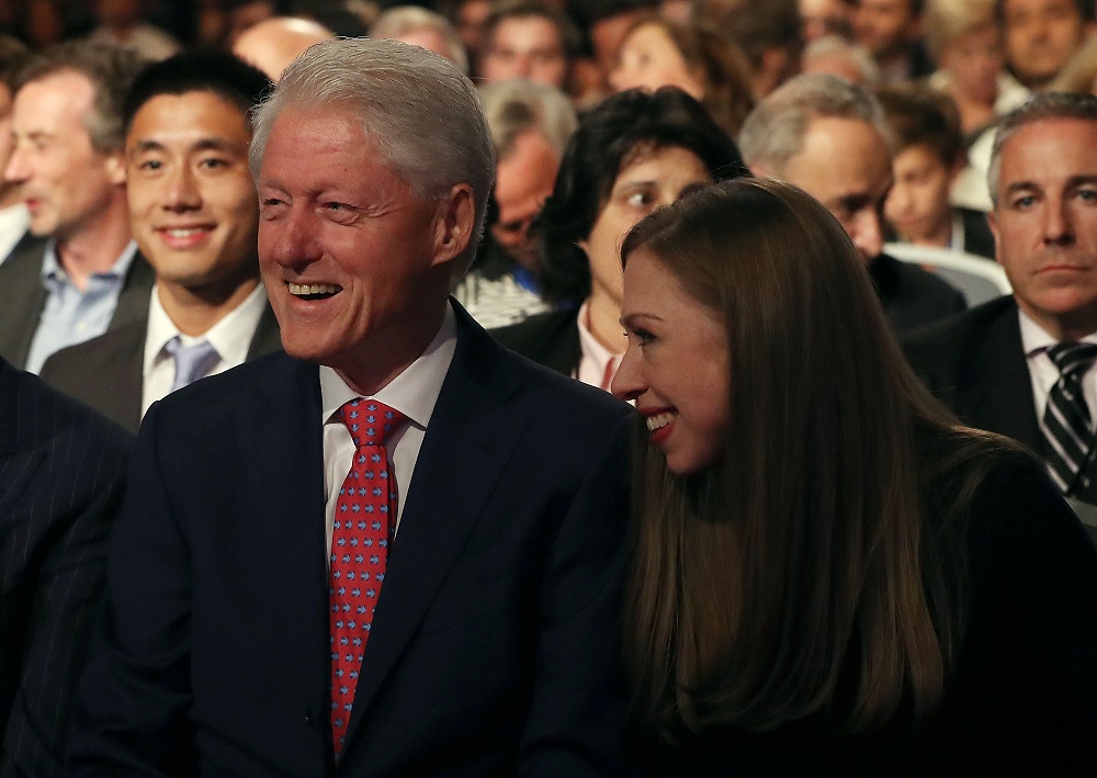 HEMPSTEAD, NY - SEPTEMBER 26: Former U.S. president Bill Clinton (L) and his daughter Chelsea Clinton (R) look on before the start of the first presidential debate with Democratic presidential nominee Hillary Clinton and Republican presidential nominee Donald Trump at Hofstra University on September 26, 2016 in Hempstead, New York. Tonight is the first of four debates for the 2016 election - three presidential and one vice presidential. (Photo by Justin Sullivan/Getty Images)