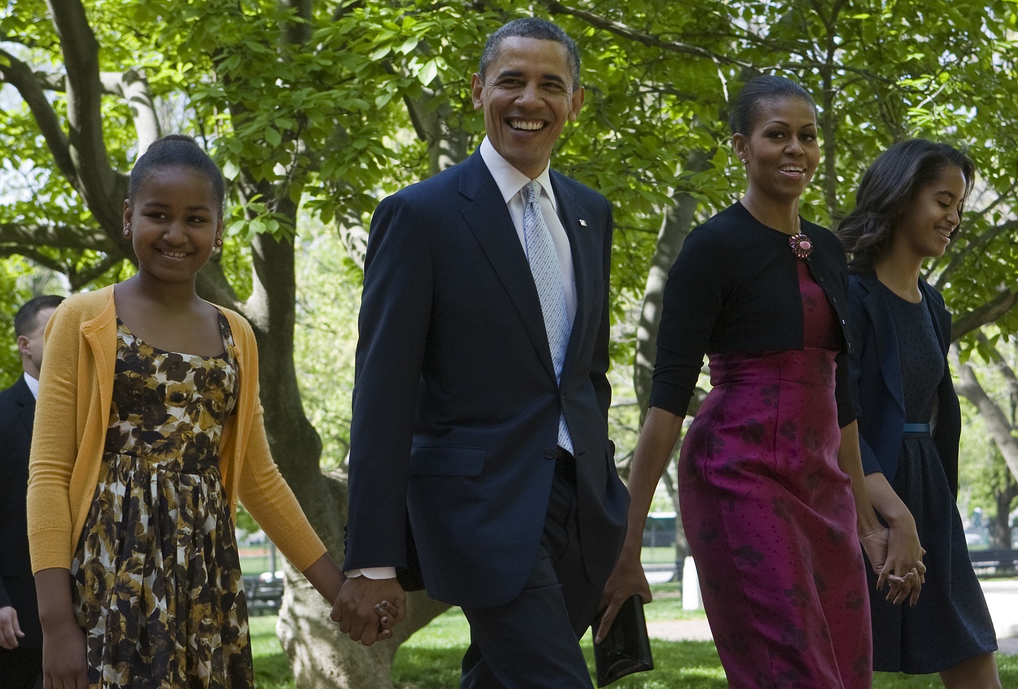 8 April 2012 - Washington, D.C. - President Barack Obama, First Lady Michelle Obama and daughters Sasha and Malia Obama walk across Lafayette Park to attend easter services at St. John's Episcopal Church. (Photo by Kristoffer Tripplaar/Pool/Corbis via Getty Images)