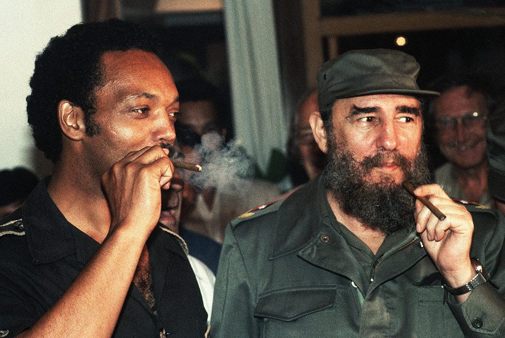 Jesse Jackson smokes Cuban cigars with Fidel Castro during a controversial visit to Havana in June 1984. Jackson, a candidate for President of the United States, caused a stir in the U.S. government and press by visiting with the Communist leader. (Photo by �� Jacques M. Chenet/CORBIS/Corbis via Getty Images)