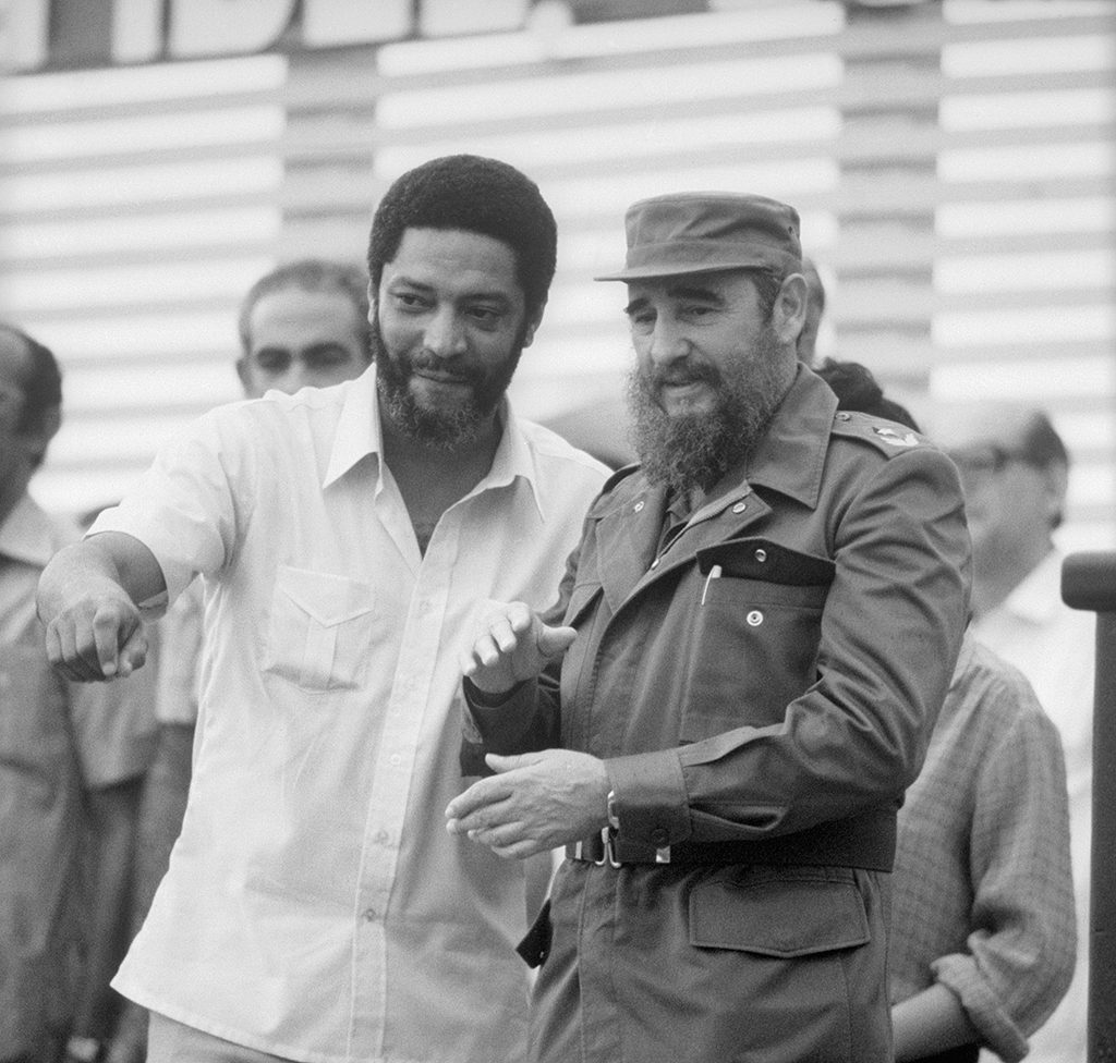 (Original Caption) Prime Minister Maurice Bishop, shown here with Cuban Premier Fidel Castro at a celebration in Havana July, 1983, was shot and killed by government soldiers October 19, Grenada's military commander said. The commander said that Bishop was killed when he tried to hand out weapons to a crowd of 3,000 supporters shortly after they freed him from house arrest.