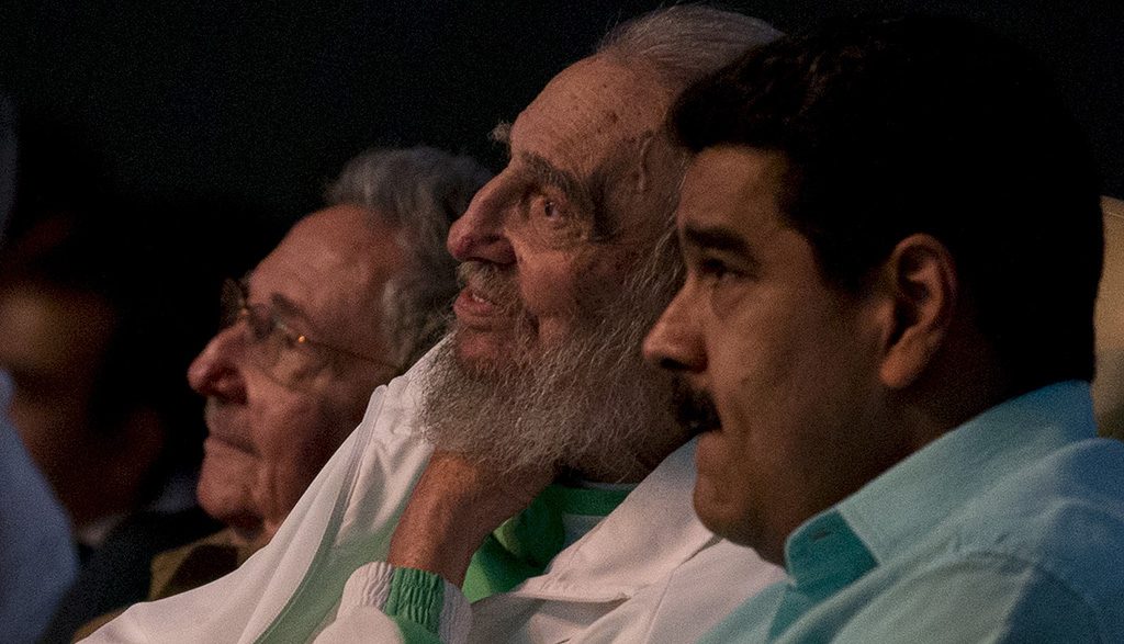 In this handout picture released by the Cuban website www.cubadebate.cu, former Cuban President Fidel Castro (C), sitting next to Venezuelan President Nicolas Maduro (R), is seen attending the celebration of his 90th birthday at Karl Marx theatre in Havana on August 13, 2016. / AFP PHOTO / Ismael Francisco / XGTY/RESTRICTED TO EDITORIAL USE-MANDATORY CREDIT "AFP PHOTO/CUBADEBATE.CU" NO MARKETING NO ADVERTISING CAMPAIGNS-DISTRIBUTED AS A SERVICE TO CLIENTS-GETTY OUT