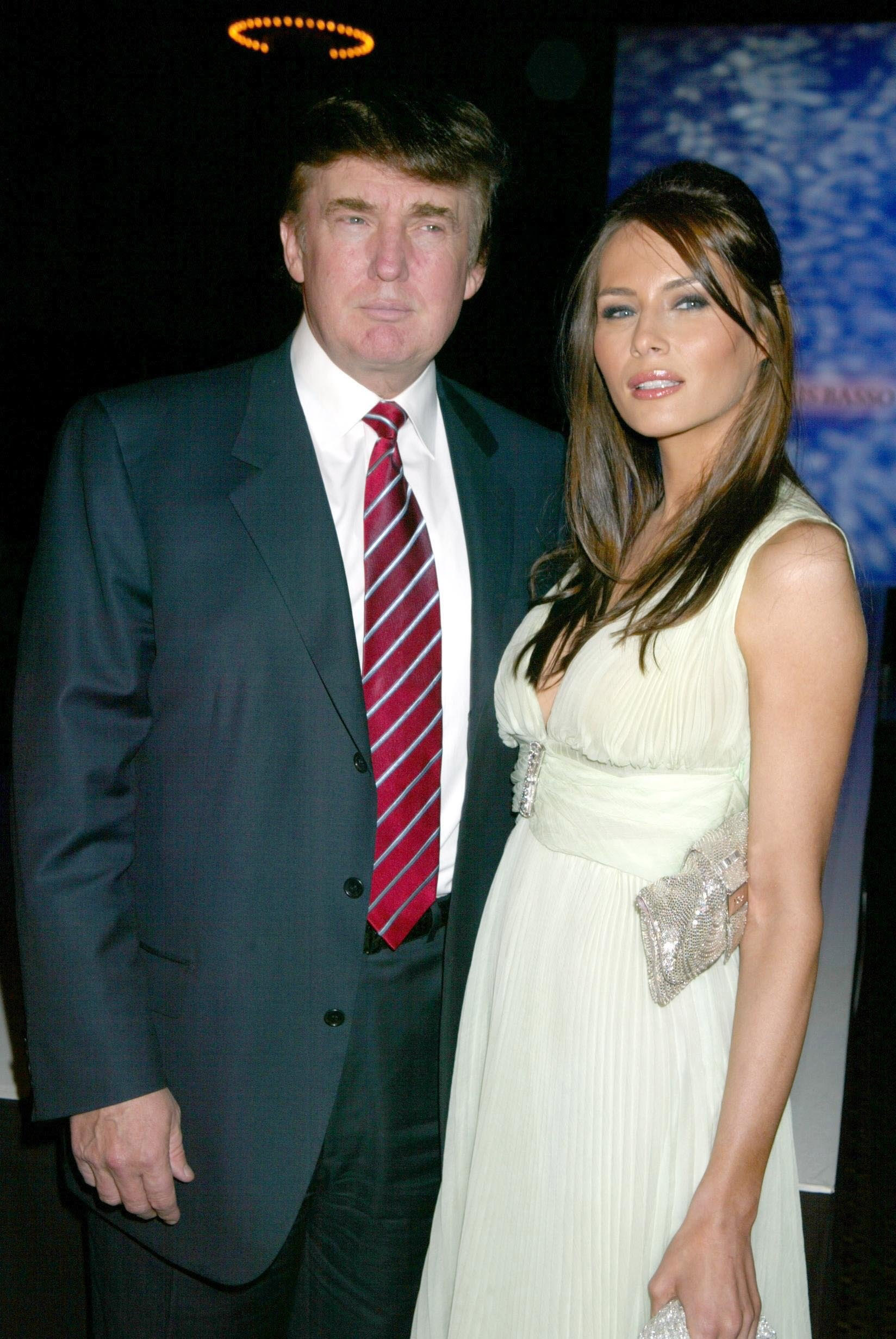 DONALD TRUMP AND MELANIA KNAUSS during DENNIS BASSO'S 2003 TWENTIETH ANNIVERSARY COLLECTION at Cipriani 42nd Street in New York, New York, United States. (Photo by Sylvain Gaboury/FilmMagic)