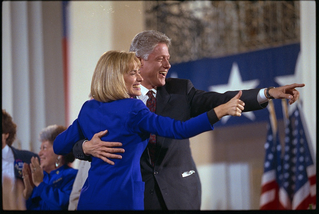 President-elect Bill Clinton and his wife, Hillary, acknowledge the crowd of supporters at a victory celebration at the Old State House in Little Rock following the 1992 election. (Photo by David Turnley/Corbis/VCG via Getty Images)