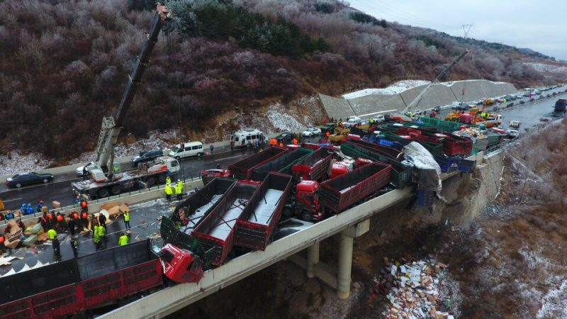 Aerial view of damaged vehicles after the pile-up on the BeijingKunming Expressway in Pingyang, north China's Shanxi province, 21 November 2016. Four people were killed and another 40 injured in an accident when a pile-up on an expressway in north China's Shanxi province, Monday (21 November 2016) morning. The pile-up took place around 9:00 am and 37 vehicles were involved in the accident on the highway linking Beijing and Kunming. Slippery road as a result of heavy fog was thought to be the cause of the pile-up.