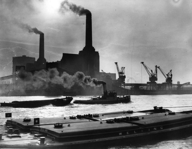12th February 1937: Smoke belches from the famous chimneys of London's Battersea Power Station. (Photo by Fox Photos/Getty Images)
