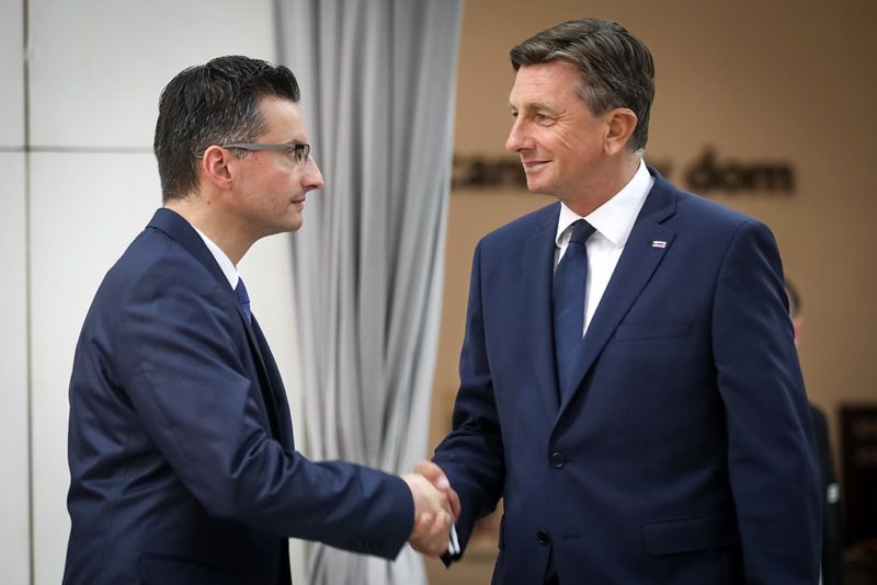 LJUBLJANA, SLOVENIA - OCTOBER 22: Incumbent Slovenian President Borut Pahor (R) shakes hands with Mayor of the town of Kamnik and Presidential candidate Marjan Sarec (L) during their meeting in Ljubljana, Slovenia on October 22, 2017. Some 1.7 million registered voters will choose among nine candidates, five of whom are women. 
 Ales Beno / Anadolu Agency