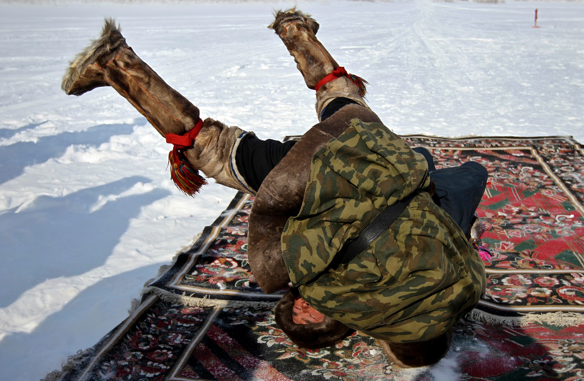 Competition in traditional Nenets wrestling at the "Day of the reindeer herdsman" festival in Schuchye village, Yamal-Nenets Autonomous District.