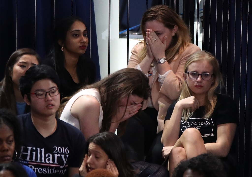 NEW YORK, NY - NOVEMBER 08: A group of women react as voting results come in at Democratic presidential nominee former Secretary of State Hillary Clinton's election night event at the Jacob K. Javits Convention Center November 8, 2016 in New York City. Clinton is running against Republican nominee, Donald J. Trump to be the 45th President of the United States. (Photo by Drew Angerer/Getty Images)
