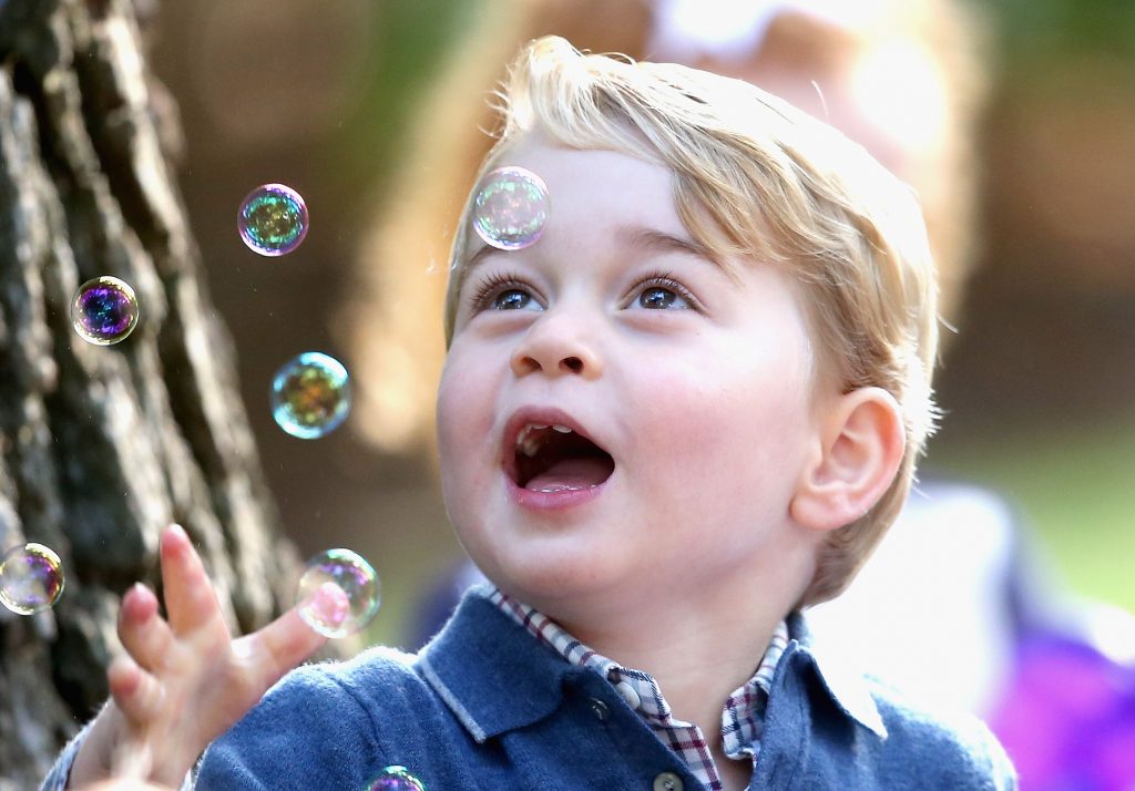 VICTORIA, BC - SEPTEMBER 29: Prince George of Cambridge plays with bubbles at a children's party for Military families during the Royal Tour of Canada on September 29, 2016 in Victoria, Canada. Prince William, Duke of Cambridge, Catherine, Duchess of Cambridge, Prince George and Princess Charlotte are visiting Canada as part of an eight day visit to the country taking in areas such as Bella Bella, Whitehorse and Kelowna (Photo by Chris Jackson - Pool/Getty Images)
