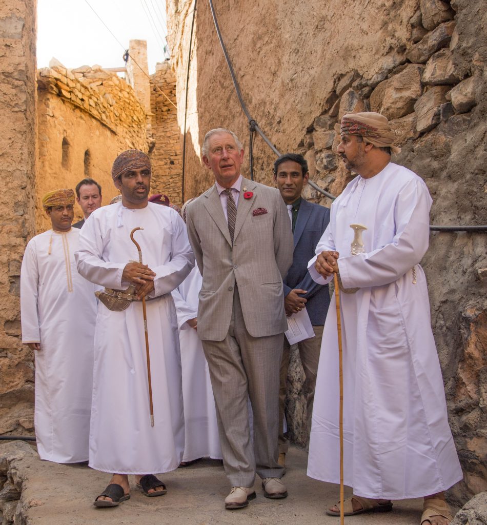 MUSCAT, OMAN - NOVEMBER 05: Prince Charles, Prince of Wales accompanied by a local guide and a representative from the Ministry of Tourism takes a walking tour of the 200 year-old village of Misfat Al Abriyeen village on November 5, 2016 in Muscat, Oman. The Prince stopped at a viewpoint overlooking the city before walking through the narrow pathways of the village and down a hill past an intricate falaj system (the traditional irrigation method) to a restored building which has been turned into a hostel for visitors. Prince Charles, Prince of Wales and Camilla, Duchess of Cornwall are on a Royal tour of the Middle East starting with Oman, then the UAE and finally Bahrain. (Photo by Arthur Edwards - Pool/Getty Images) Misfat al Abriyeen is a unique mountainous village divided into two distinct settlements the Old and New villages. The Old village, that His Royal Highness will be touring, was built over 200 years ago and is a traditional Omani village, complete with agricultural terraces along the mountain slopes and traditional mud houses built with carved wooden doors, palm frond roofs and solid rock foundations Picture: Arthur Edwards