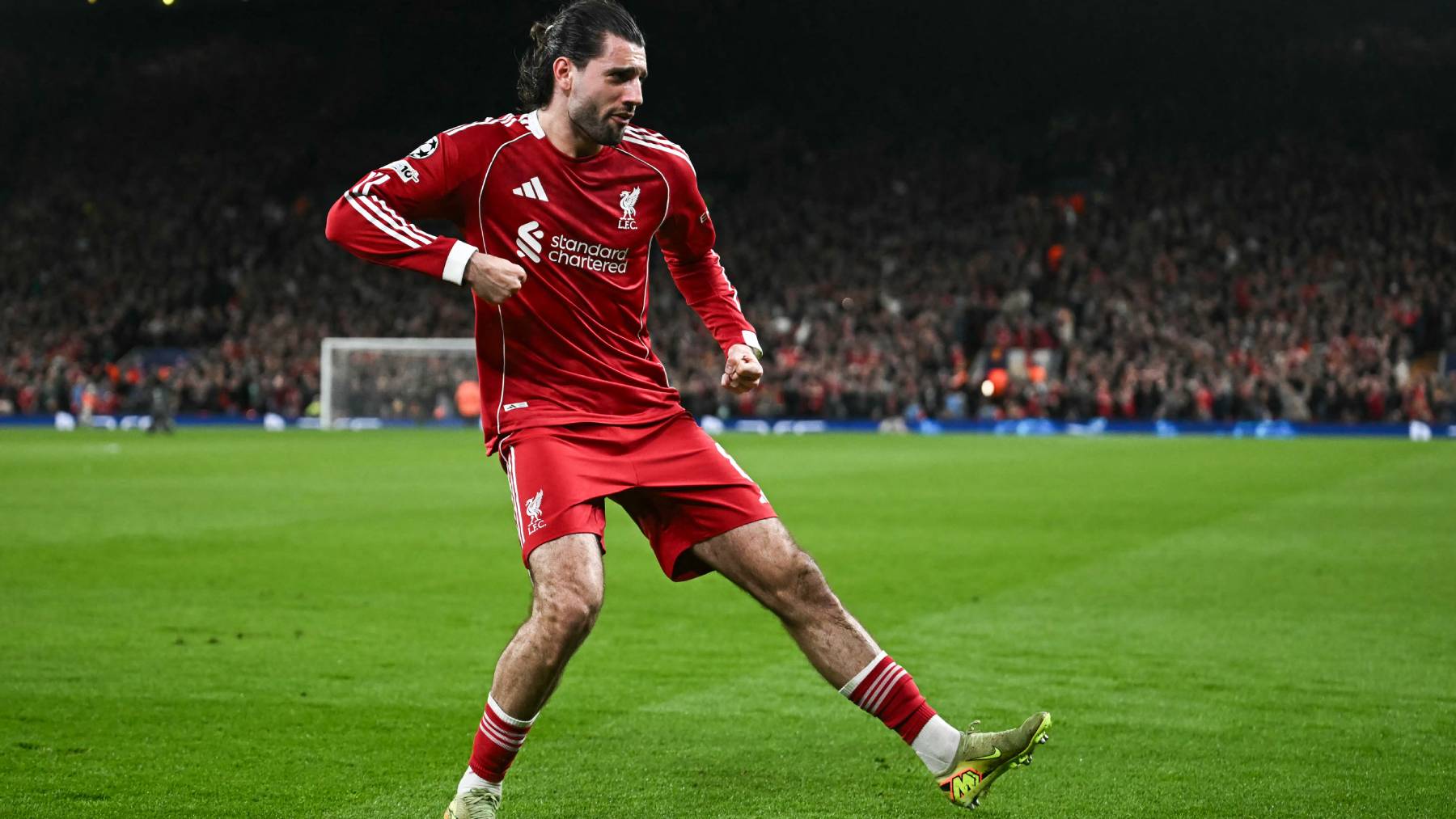 Liverpool's Hungarian midfielder #08 Dominik Szoboszlai celebrates scoring his team's first goal during the UEFA Champions League, round of 16 second leg football match between Liverpool and Galatasaray at Anfield in Liverpool, north-west England on March 18, 2026.